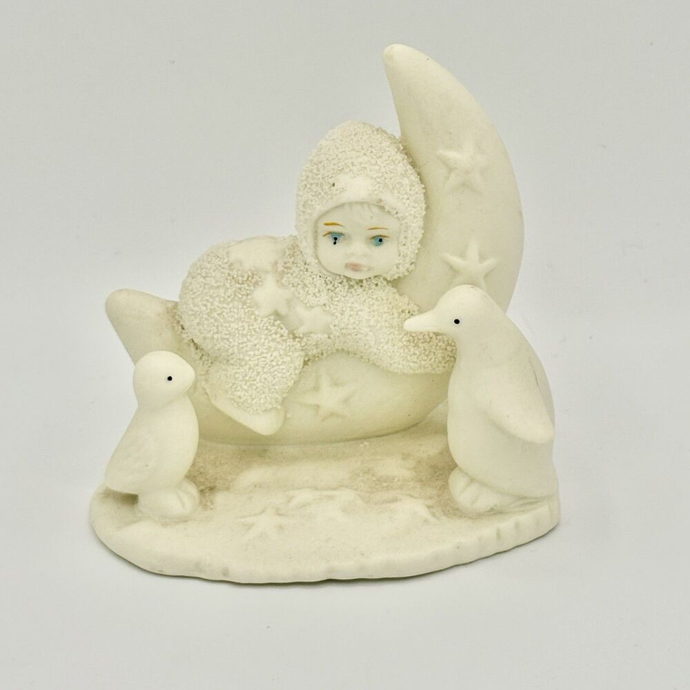 Moonchild Baby in Snowsuit Figurine on Cresent Moon with Penguins